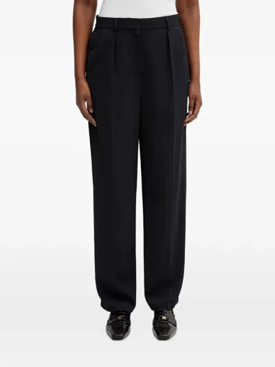Lacoste Pleated Logo-patch Trousers In Blue
