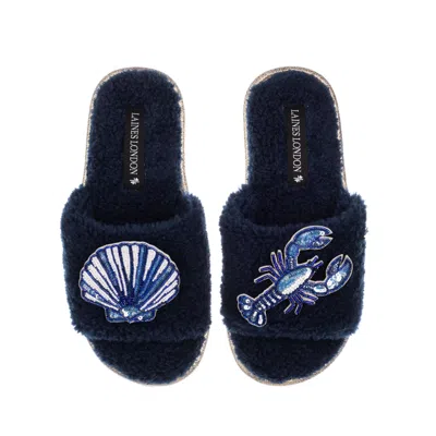 Laines London Women's Blue Teddy Toweling Slipper Slider With Mediterranean Shell & Lobster Brooches - Navy