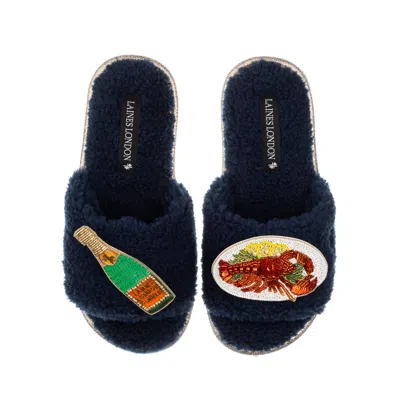 Laines London Women's Blue Teddy Toweling Slipper Sliders With Lobster Platter & Champagne Bottle Brooches - Navy
