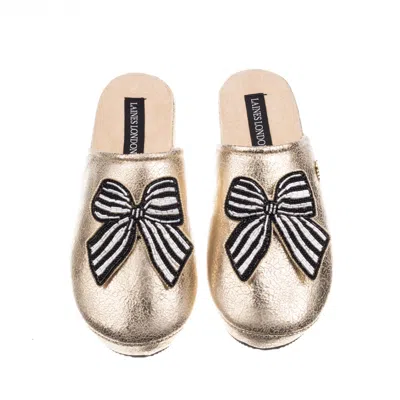 Laines London Women's  Gold Softie Slippers With Black Stripe Bow Brooches