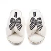 Laines London Women's Neutrals / White Laines Neutral Boucle Slippers With Black Stripe Bow Brooches - Cream In White