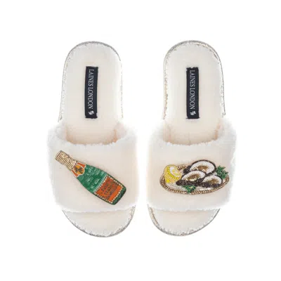 Laines London Women's White Teddy Toweling Slipper Sliders With Champers Bottle & Oyster Brooches - Cream