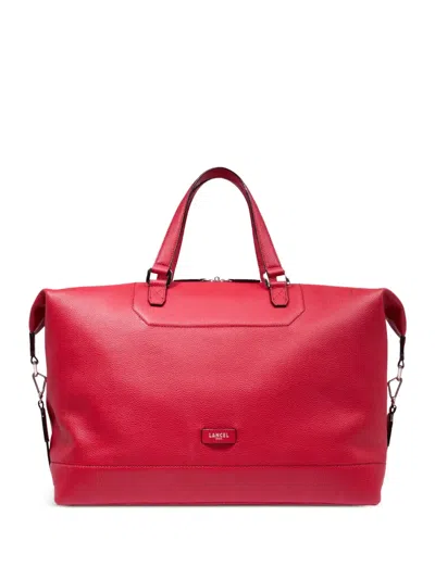Lancel Embossed Luggage Bag In Pink