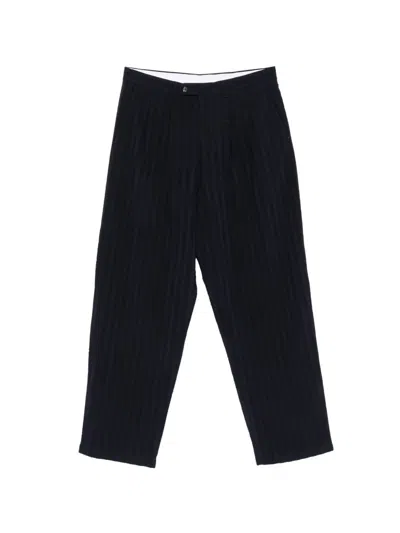 Lc23 Pinstripe-pattern Pleated Trousers In Blue