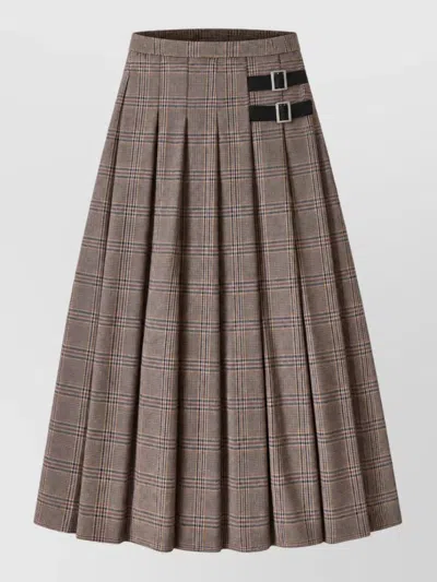 Le Sully Studio Buckled Pleated Prince Of Wales Check Skirt In Brown