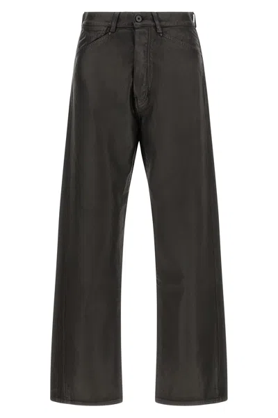 Lemaire Coated Denim Jeans In Braun