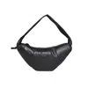 Lemaire Crescent-shaped Handbag With Pleated Detailing And Padded Strap In Black