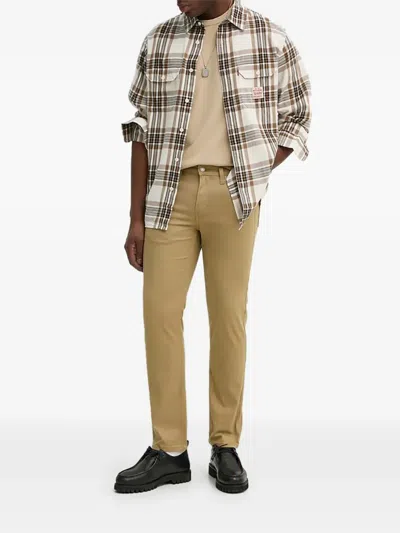 Levi's 511 버튼 클로저 진 In Brown