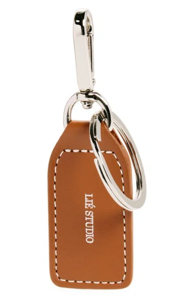 Lie Studio Lié Studio The Gaby Leather Tag Key Ring In Toffee Brown