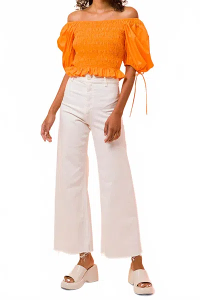 Line And Dot Amber Smocked Top In Orange