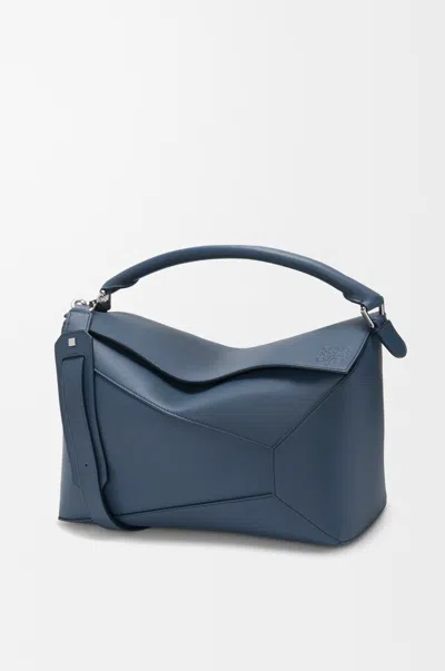Loewe Puzzle Edge Large Logo-debossed Leather Messenger Bag In Blue