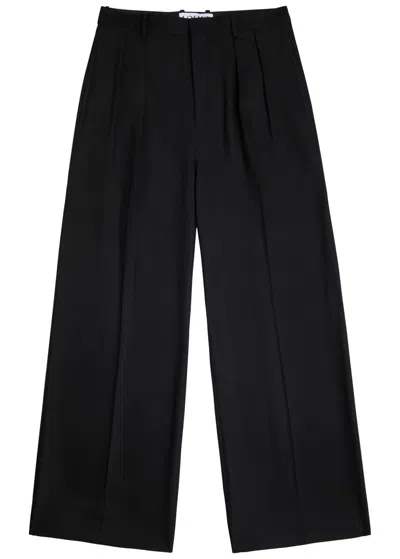 Loewe Logo-embroidered Woven Trousers In Black