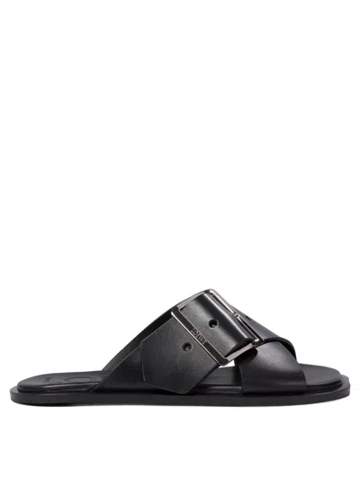 Loewe Petal Belt Cross-over Sandals In Black