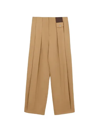 Loewe Pleated Leather-patch Trousers In Brown