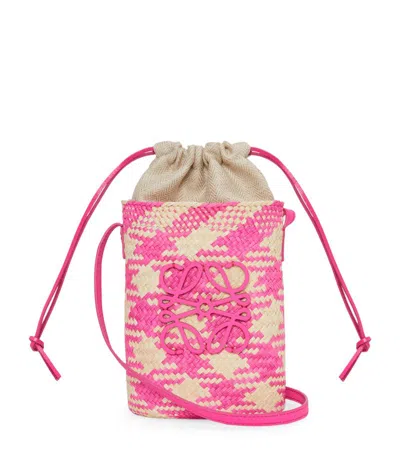 Loewe X Paula's Ibiza Iraca Pocket In Checkered Iraca Palm With Leather Strap In Natural/fuchsia