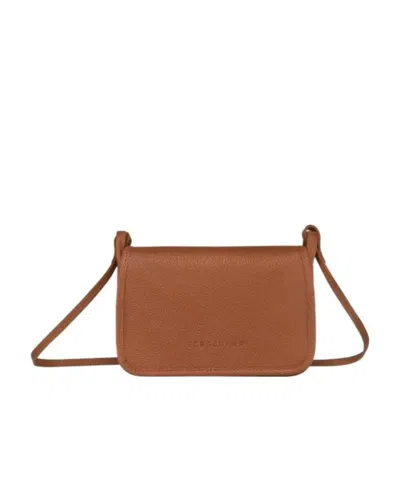 Longchamp Debossed-logo Cross Body Bag In Brown