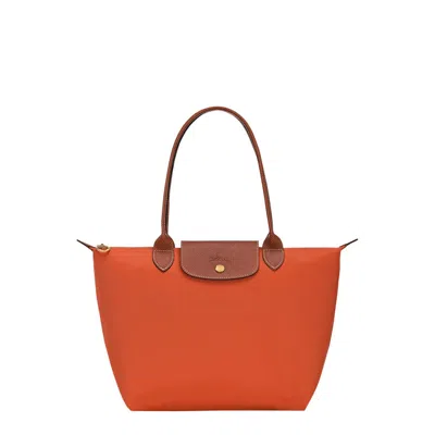 Longchamp Le Pilage Original Red Medium Tote Bag With Two Top Handles And Embossed Logo On The Front