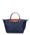 Shop Longchamp Le Pliage Medium Top Handle Bag
