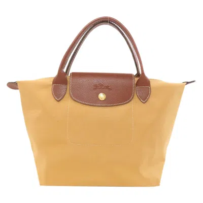 Pre-owned Longchamp Nylon Handbag () In Brown
