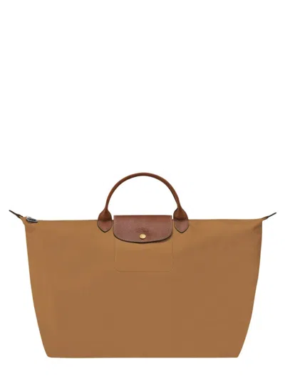 Longchamp Spacious Travel Bag With Structured Silhouette And Leather Accents In Brown