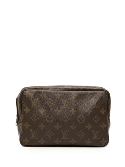 Pre-owned Louis Vuitton 1983 Monogram Trousse Toilette 23 Clutch Bag In Brown