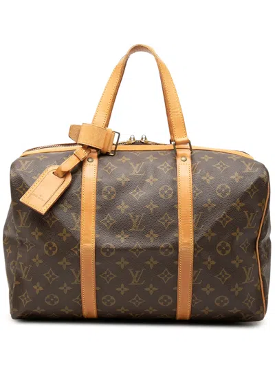 Pre-owned Louis Vuitton 1990 Monogram Sac Souple 35 Travel Bag In Brown