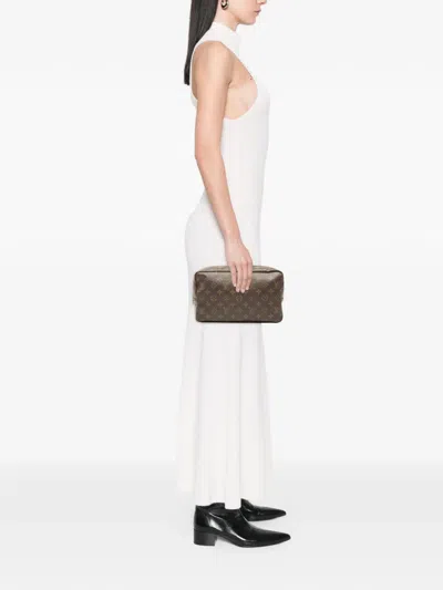 Pre-owned Louis Vuitton 1990 Monogram Trousse Toilette 28 Clutch Bag In Brown