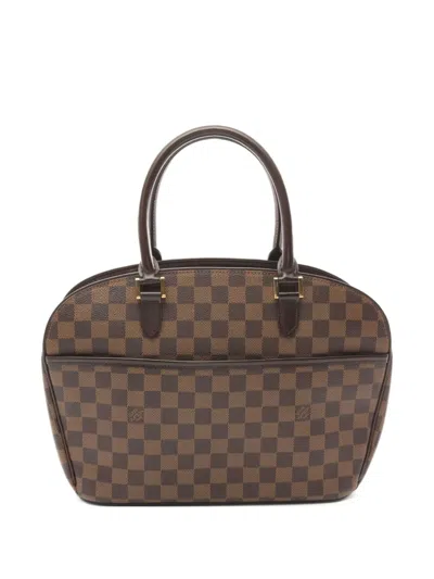 Pre-owned Louis Vuitton 2001 Saria Horizontal Handbag In Brown