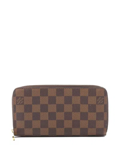 Pre-owned Louis Vuitton 2008 Damier Ebene Zip Wallet In Brown