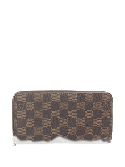 Pre-owned Louis Vuitton 2008 Damier Ebene Zippy Wallet In Brown