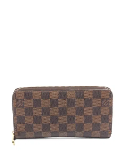 Pre-owned Louis Vuitton 2008 Damier Ebene Zippy Wallet In Brown