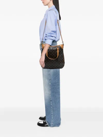 Pre-owned Louis Vuitton 2009 Monogram Odeon Gm Satchel In Brown