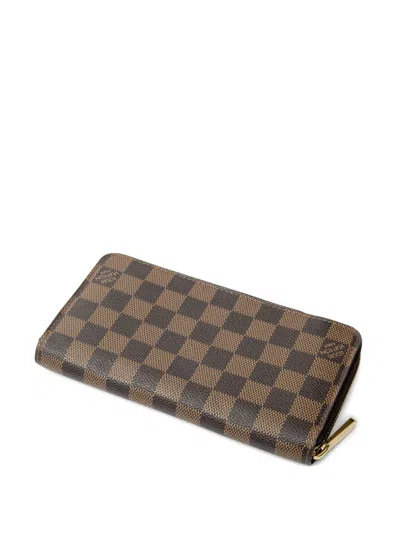 Pre-owned Louis Vuitton 2009 Zippy Patterned Wallet In Brown