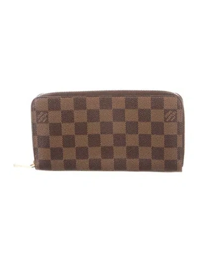 Pre-owned Louis Vuitton 2010 Damier Ebene Pattern Zippy Wallet In Brown