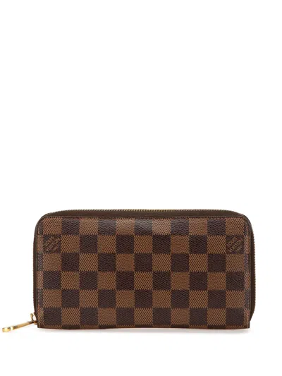 Pre-owned Louis Vuitton 2011 Damier Ebene Zippy Wallet Long Wallets In Brown