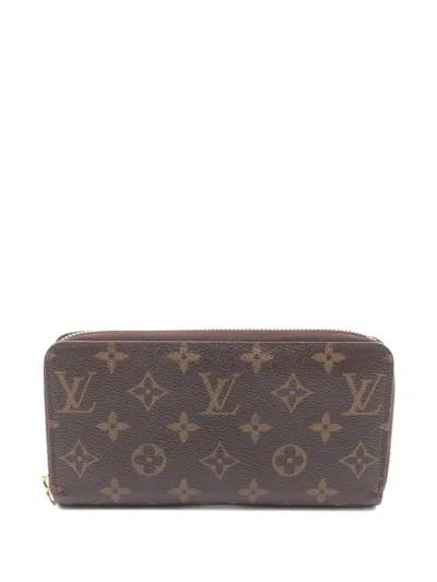 Pre-owned Louis Vuitton 2011 Monogram-pattern Zipper Wallet In Brown