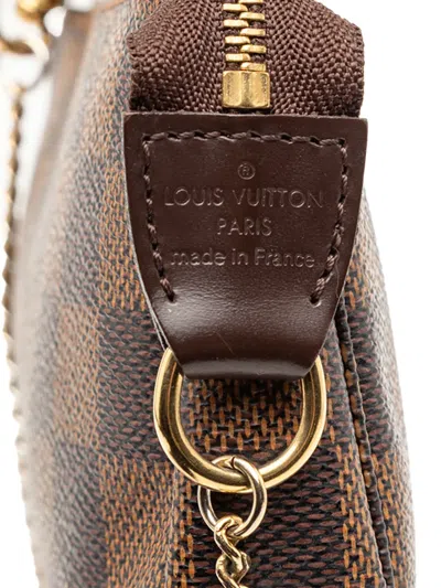 Pre-owned Louis Vuitton 2012 Damier Ebene Mini Pochette Accessoires Handbag In Brown