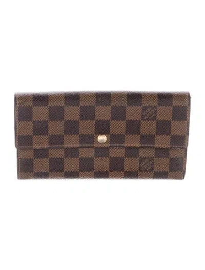 Pre-owned Louis Vuitton 2012 Damier Ebene Pattern Wallet In Brown