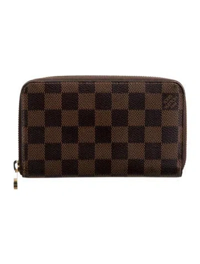 Pre-owned Louis Vuitton 2012 Damier Ebene Pattern Zippy Compact Wallet In Brown