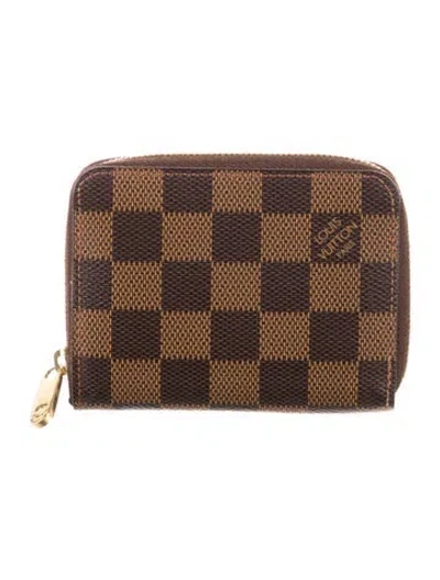 Pre-owned Louis Vuitton 2012 Damier Ebene Pattern Zippy Compact Wallet In Brown