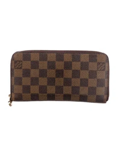 Pre-owned Louis Vuitton 2012 Damier Ebene Pattern Zippy Wallet In Brown
