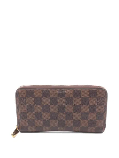Pre-owned Louis Vuitton 2012 Damier Ebene Zippy Wallet In Brown