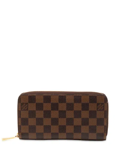Pre-owned Louis Vuitton 2012 Damier Ebene Zippy Wallet Long Wallets In Brown