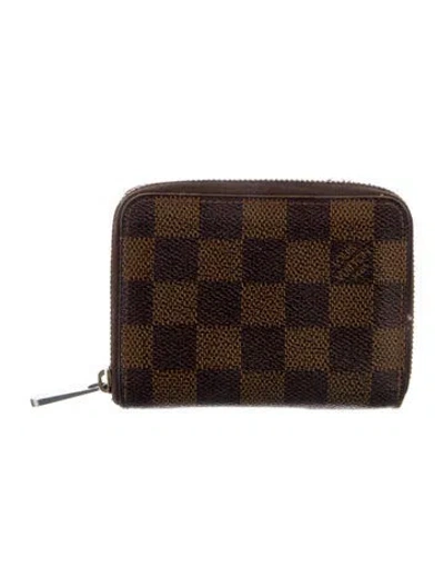 Pre-owned Louis Vuitton 2013 Damier Ebene Pattern Zippy Coin Purse In Brown