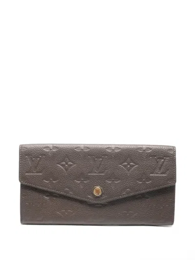 Pre-owned Louis Vuitton 2014 Curieuse Monigram Long Wallet In Brown