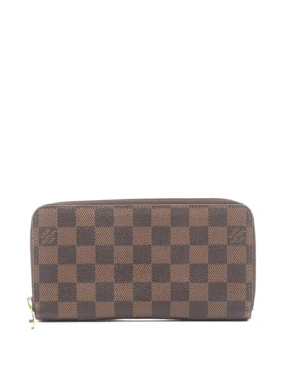 Pre-owned Louis Vuitton 2014 Damier Ebène Canvas Zip Wallet In Brown