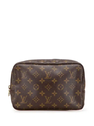 Pre-owned Louis Vuitton 2014 Monogram Trousse Toilette 23 Clutch Bag In Brown