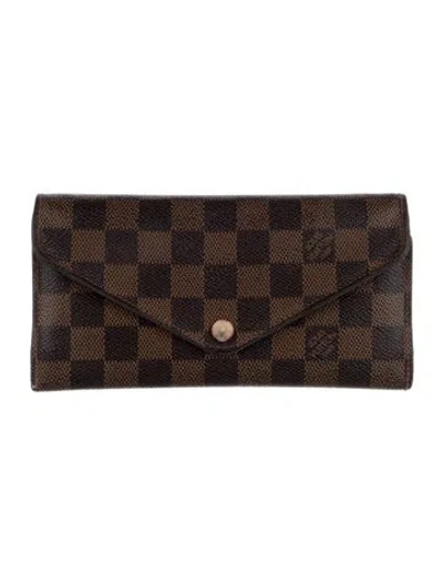 Pre-owned Louis Vuitton 2015 Damier Ebene Pattern Sarah Wallet In Brown