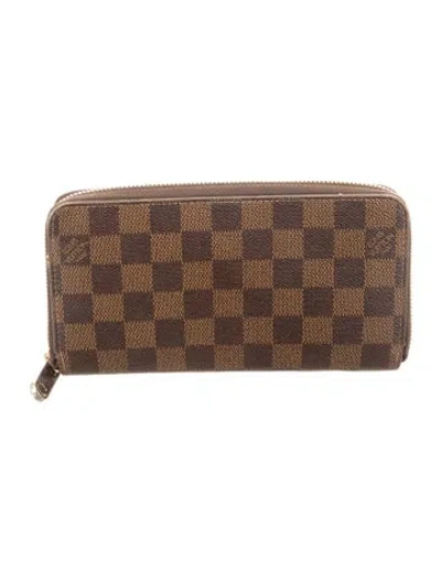 Pre-owned Louis Vuitton 2015 Damier Ebene Pattern Zippy Wallet In Brown