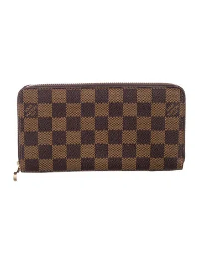 Pre-owned Louis Vuitton 2015 Damier Ebene Pattern Zippy Wallet In Brown